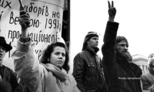 Students from Revolution on Granite waving flags